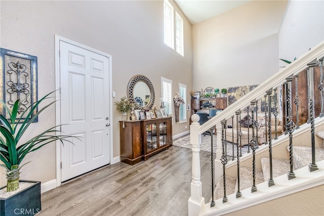 14655 Spanish Bay Way, Chowchilla, CA 93610 - entrance foyer featuring wood finished floors, a towering ceiling, and stairway