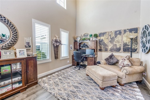 14655 Spanish Bay Way, Chowchilla, CA 93610 - home office with light wood-style floors and a towering ceiling