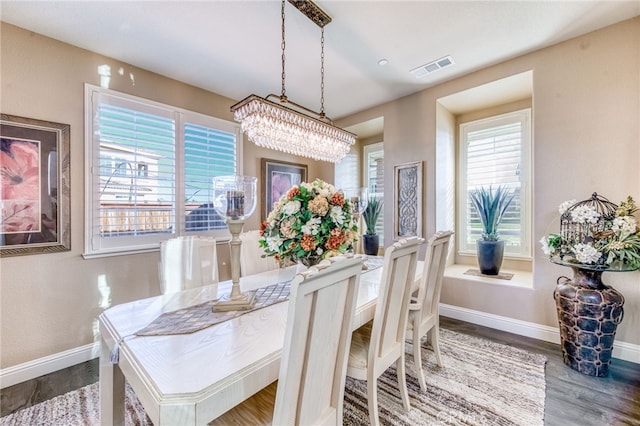14655 Spanish Bay Way, Chowchilla, CA 93610 - dining space featuring wood finished floors and a chandelier