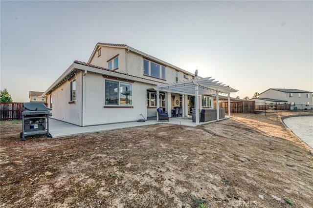 14655 Spanish Bay Way, Chowchilla, CA 93610 - rear view of property featuring a pergola, a fenced backyard, a patio, stucco siding, and a tiled roof