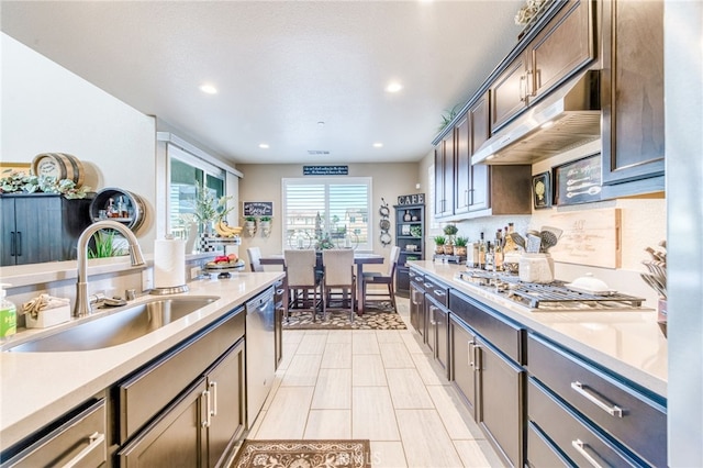 14655 Spanish Bay Way, Chowchilla, CA 93610 - kitchen with stainless steel appliances, light countertops, recessed lighting, under cabinet range hood, and dark brown cabinetry