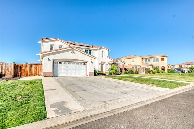 14655 Spanish Bay Way, Chowchilla, CA 93610 - mediterranean / spanish house with solar panels, driveway, a residential view, and stucco siding
