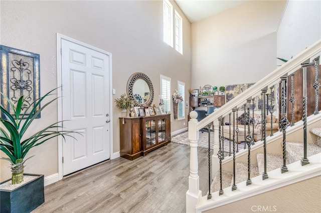14655 Spanish Bay Way, Chowchilla, CA 93610 - foyer entrance with a high ceiling, light wood-style flooring, and stairway