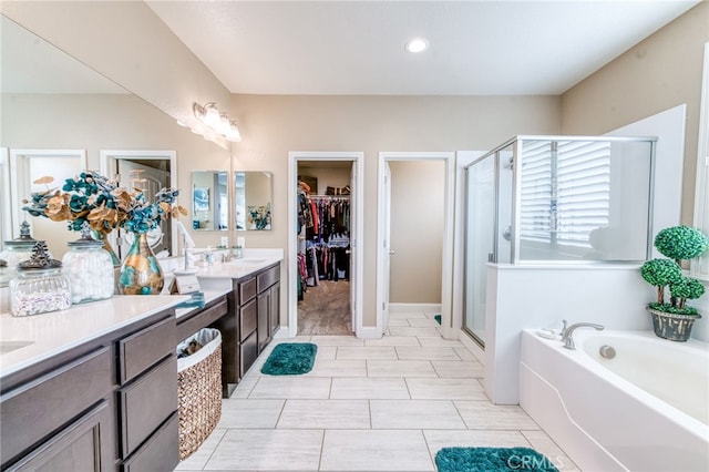 14655 Spanish Bay Way, Chowchilla, CA 93610 - full bath with double vanity, a stall shower, a garden tub, a walk in closet, and tile patterned flooring
