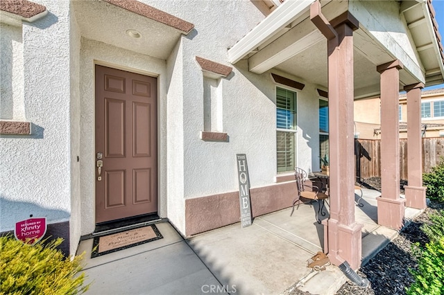 14655 Spanish Bay Way, Chowchilla, CA 93610 - view of exterior entry with stucco siding and a patio