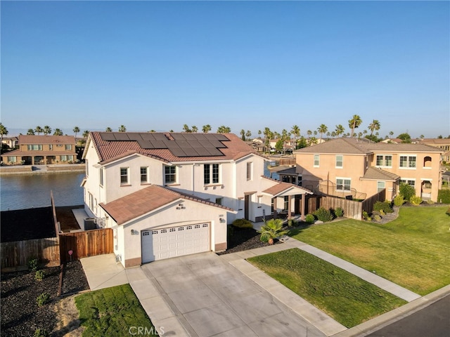 14655 Spanish Bay Way, Chowchilla, CA 93610 - mediterranean / spanish home featuring a tile roof, concrete driveway, a residential view, and stucco siding