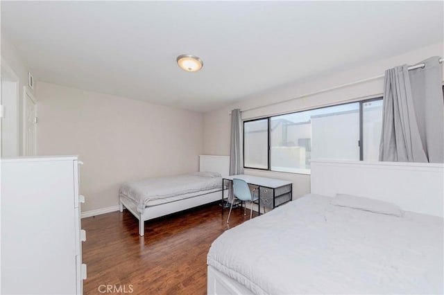 9724 Walker Ct Unit 18, Cypress, CA 90630 - bedroom with dark wood-type flooring and baseboards