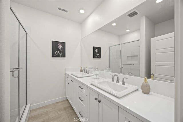 24 Bedford Ct, Arcadia, CA 91007 - bathroom with double vanity, a shower stall, and recessed lighting