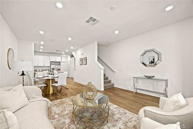 24 Bedford Ct, Arcadia, CA 91007 - living area with stairway, recessed lighting, and light wood finished floors