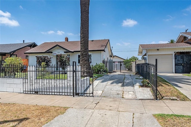 1113 W 78th St, Los Angeles, CA 90044 - view of front of home with concrete driveway and a garage