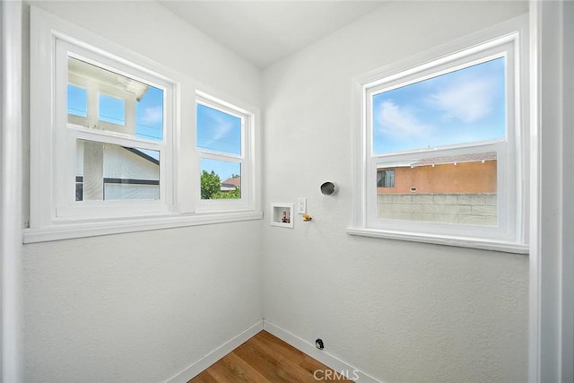 1113 W 78th St, Los Angeles, CA 90044 - laundry room featuring dark wood finished floors and washer hookup
