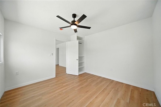 1113 W 78th St, Los Angeles, CA 90044 - unfurnished bedroom with light wood-style floors and a ceiling fan