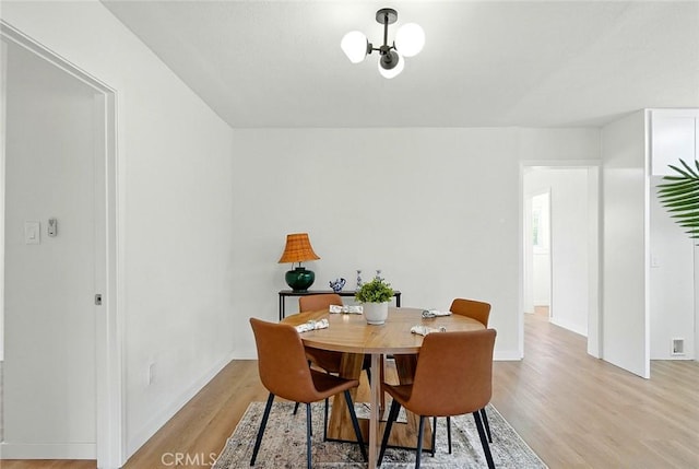1113 W 78th St, Los Angeles, CA 90044 - dining space featuring light wood-style flooring and baseboards