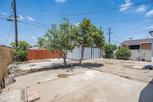 1113 W 78th St, Los Angeles, CA 90044 - fenced backyard featuring an outbuilding and a patio area
