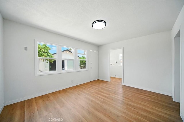 1113 W 78th St, Los Angeles, CA 90044 - unfurnished room featuring light wood-type flooring and baseboards