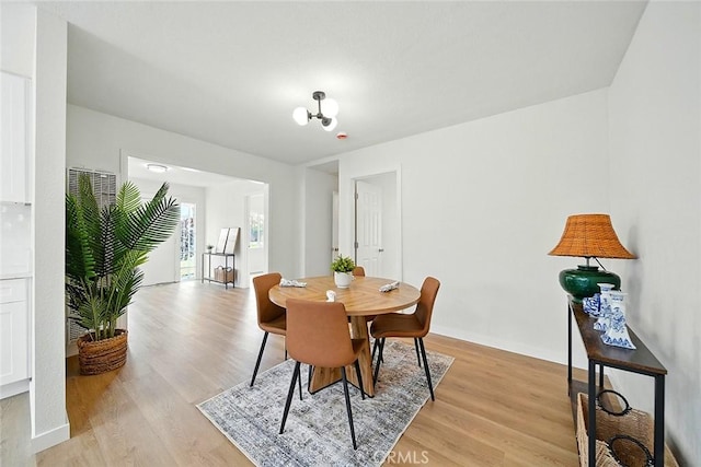 1113 W 78th St, Los Angeles, CA 90044 - dining area with light wood finished floors
