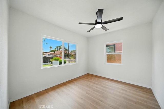 1113 W 78th St, Los Angeles, CA 90044 - empty room with light wood-style floors and a ceiling fan
