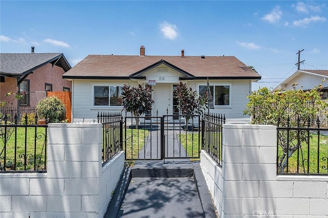 1113 W 78th St, Los Angeles, CA 90044 - bungalow with a fenced front yard and a gate