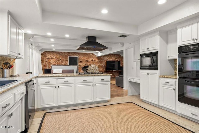 1140 W Lancaster Blvd, Lancaster, CA 93534 - kitchen with ventilation hood, black appliances, open floor plan, a peninsula, and white cabinets