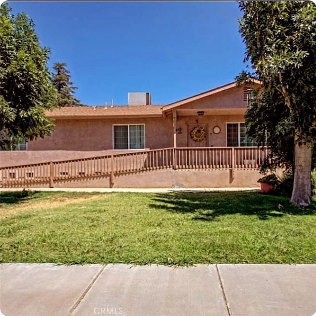 9250 Latham Dr, Planada, CA 95365 - back of house with stucco siding