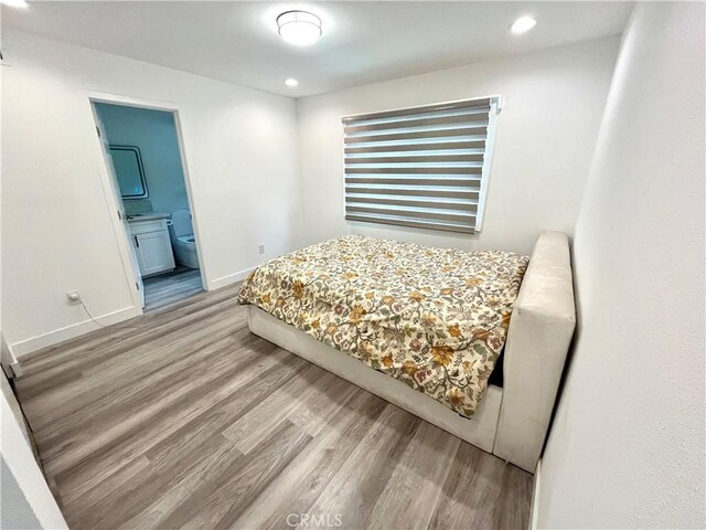 125 Campanita Ct, Monterey Park, CA 91754 - bedroom with wood finished floors, recessed lighting, and ensuite bath