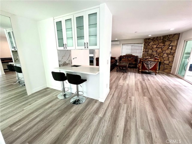 125 Campanita Ct, Monterey Park, CA 91754 - kitchen with light wood-type flooring, light countertops, an office area, and a breakfast bar area