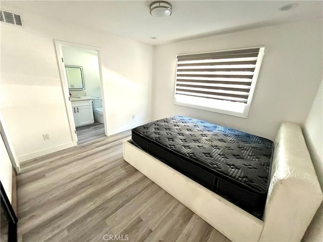 125 Campanita Ct, Monterey Park, CA 91754 - bedroom with light wood-type flooring and connected bathroom