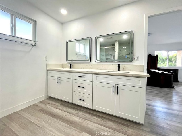 125 Campanita Ct, Monterey Park, CA 91754 - bathroom with a shower stall, double vanity, wood finished floors, and recessed lighting