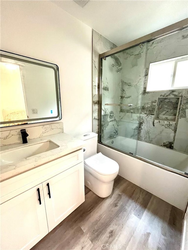 125 Campanita Ct, Monterey Park, CA 91754 - full bathroom with wood finished floors, enclosed tub / shower combo, and vanity