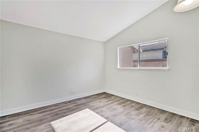 6470 Flamingo Dr, Buena Park, CA 90620 - spare room featuring vaulted ceiling and wood finished floors