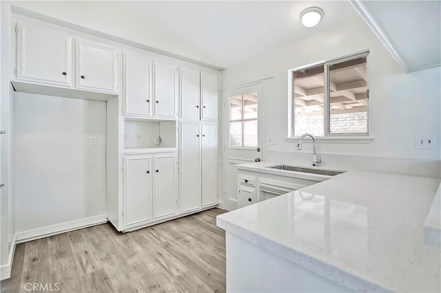 6470 Flamingo Dr, Buena Park, CA 90620 - kitchen featuring white cabinetry, light wood-style flooring, light stone countertops, and lofted ceiling