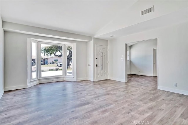 6470 Flamingo Dr, Buena Park, CA 90620 - spare room with light wood-style flooring and lofted ceiling