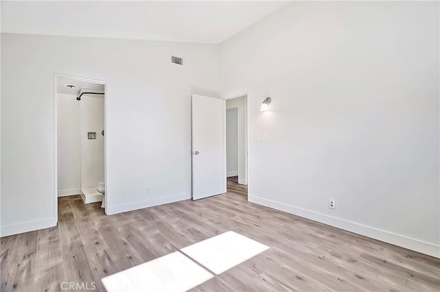 6470 Flamingo Dr, Buena Park, CA 90620 - unfurnished bedroom featuring lofted ceiling and light wood-style flooring