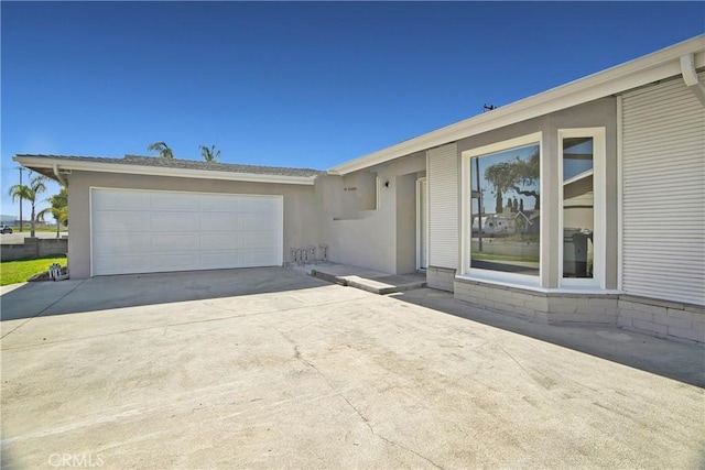 6470 Flamingo Dr, Buena Park, CA 90620 - view of front of property with concrete driveway, stucco siding, and an attached garage