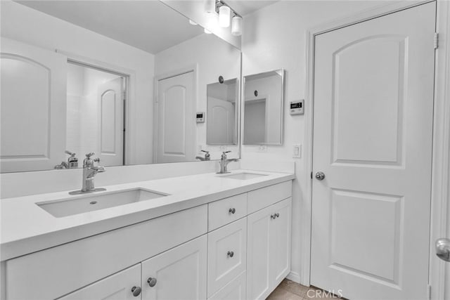 10578 Wells Dr, Rancho Cucamonga, CA 91730 - bathroom featuring double vanity and tile patterned flooring