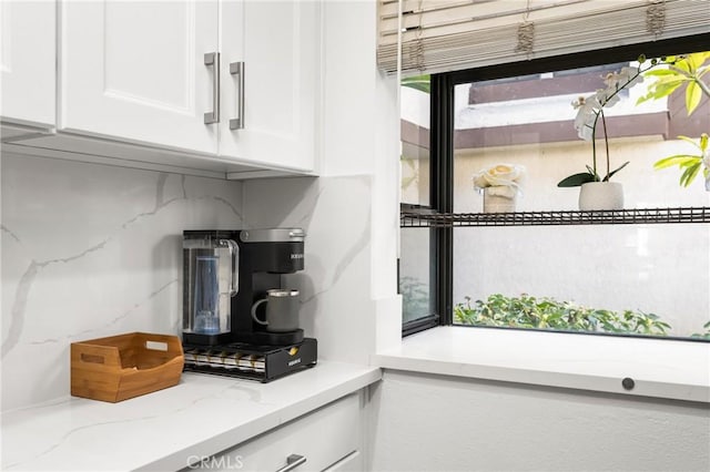 314 Molokai Dr, Placentia, CA 92870 - kitchen with white cabinets, tasteful backsplash, and light stone counters