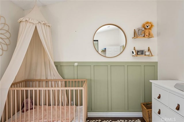 314 Molokai Dr, Placentia, CA 92870 - bedroom with a decorative wall, a crib, and wainscoting