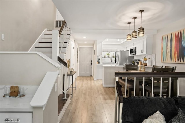 314 Molokai Dr, Placentia, CA 92870 - foyer entrance featuring light wood finished floors, stairs, and recessed lighting