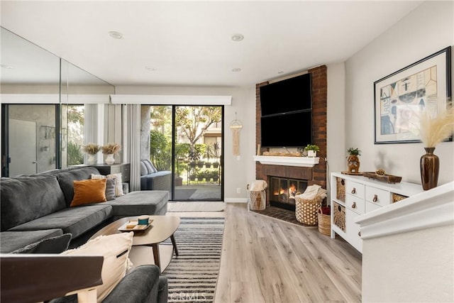 314 Molokai Dr, Placentia, CA 92870 - living area featuring a fireplace, light wood-style floors, and recessed lighting