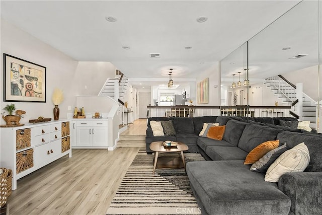 314 Molokai Dr, Placentia, CA 92870 - living area featuring stairs, light wood finished floors, a chandelier, and recessed lighting