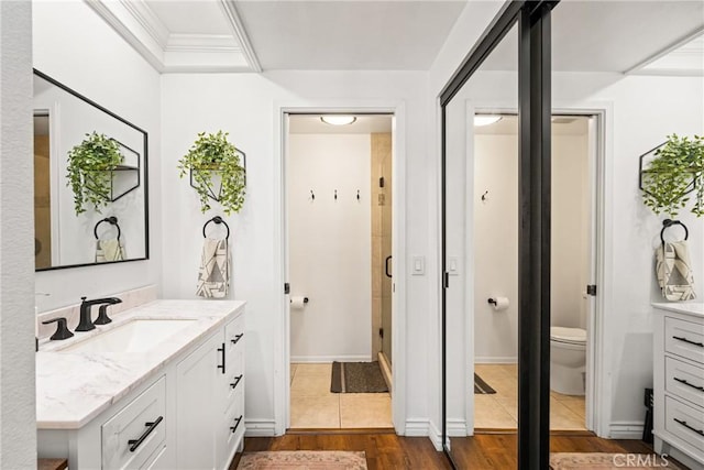 314 Molokai Dr, Placentia, CA 92870 - bathroom featuring vanity, wood finished floors, and a stall shower