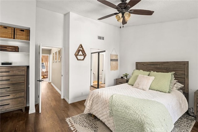314 Molokai Dr, Placentia, CA 92870 - bedroom featuring wood finished floors, a towering ceiling, a ceiling fan, ensuite bath, and a textured ceiling