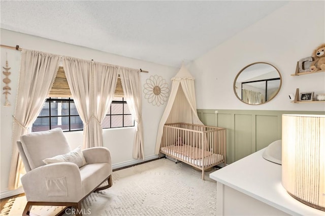 314 Molokai Dr, Placentia, CA 92870 - bedroom with a crib and a wainscoted wall