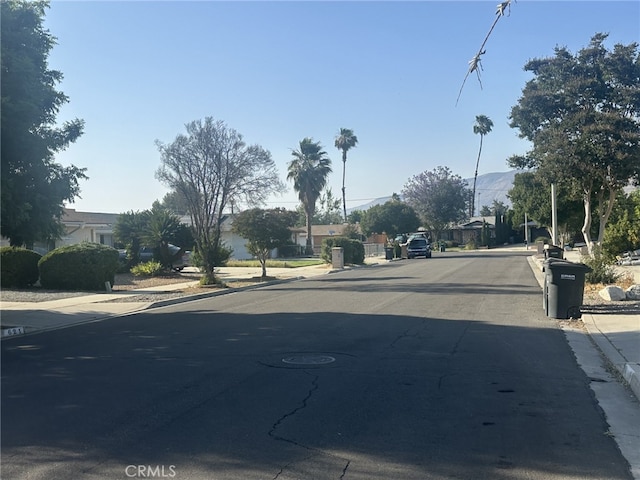 621 Brian St, Hemet, CA 92544 - view of asphalt street with curbs, sidewalks, and a residential view