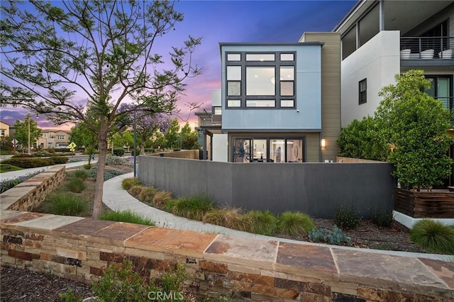 160 Mirth, Irvine, CA 92618 - rear view of property featuring a fenced front yard and stucco siding