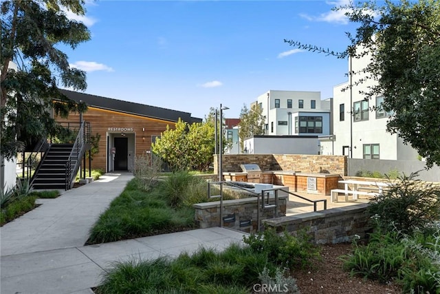 160 Mirth, Irvine, CA 92618 - view of community with stairway and an outdoor kitchen