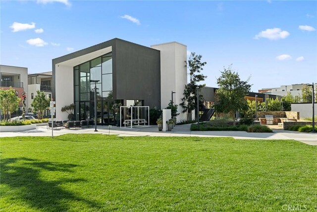 160 Mirth, Irvine, CA 92618 - rear view of property featuring a lawn