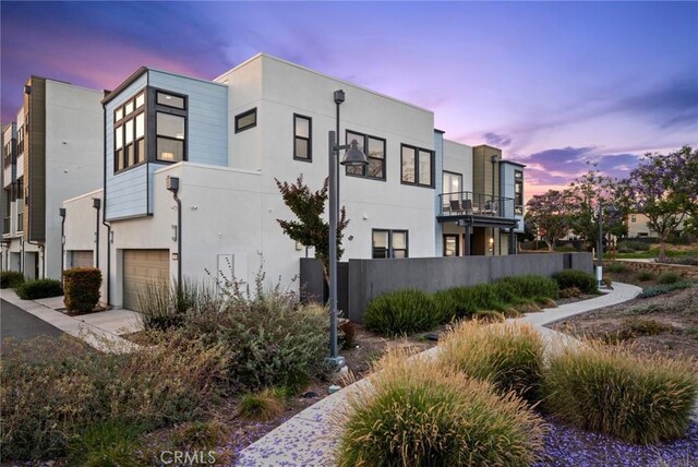 160 Mirth, Irvine, CA 92618 - view of property exterior with a garage and stucco siding