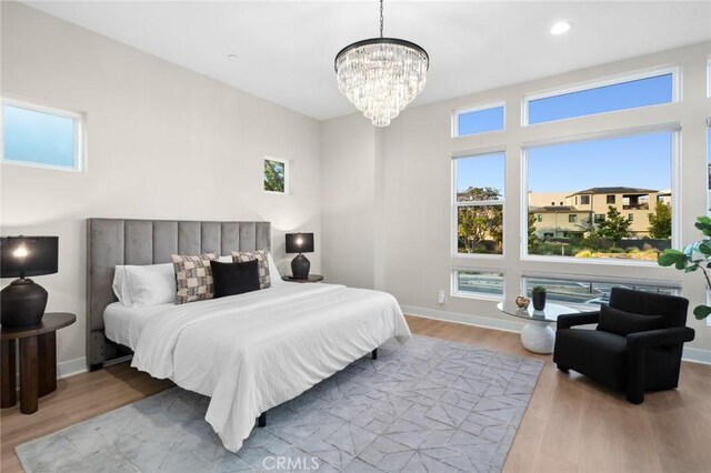 160 Mirth, Irvine, CA 92618 - bedroom with wood finished floors and a chandelier