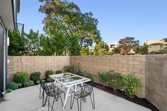 160 Mirth, Irvine, CA 92618 - fenced backyard with outdoor dining space and a patio